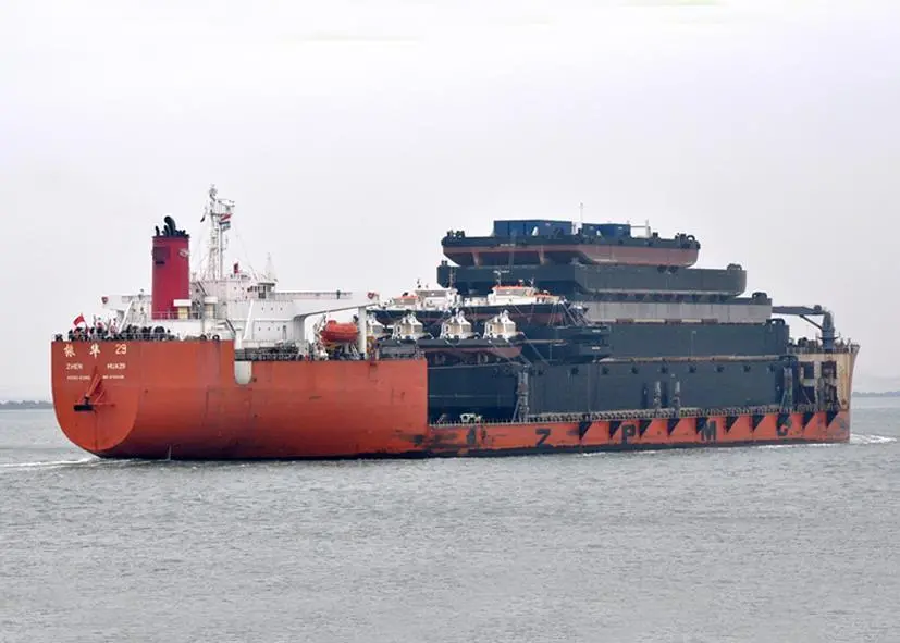 Heavy lift ship 'Zhen Hua 29' arrived in Rotterdam with a complete cargo of tugs and barges for delivery to Damen clients in Europe or to be held ‘on-stock’. Photo: R&F van der Hoek
