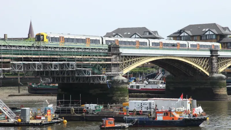 Trains keep running but houseboats will need to be moved Photo: Graeme Ewens