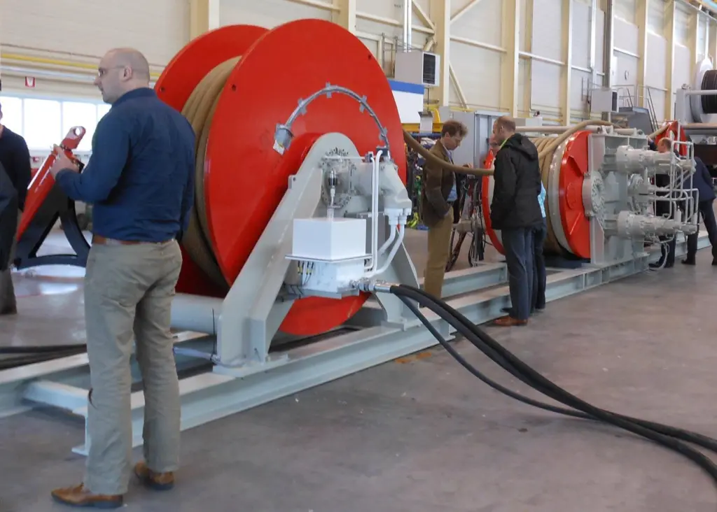 People inspect Royal IHC's fibre rope and winch system