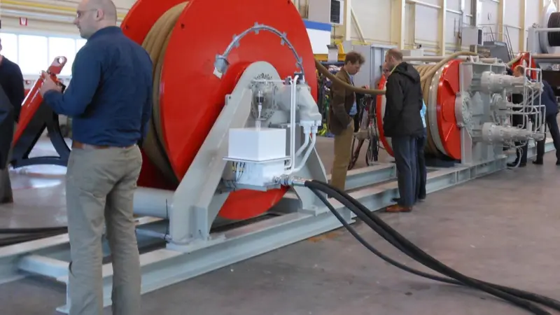 People inspect Royal IHC's fibre rope and winch system