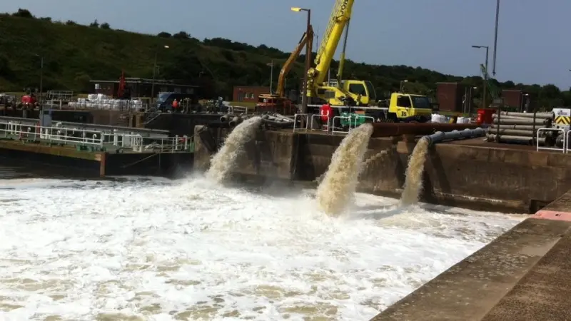 The pumps at full flow in the QE2 lock