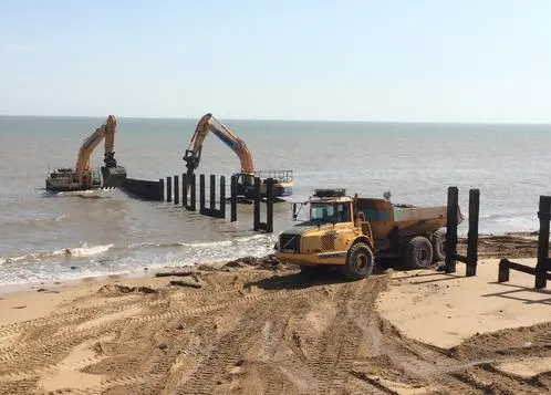 Works began with the demolition of existing groynes