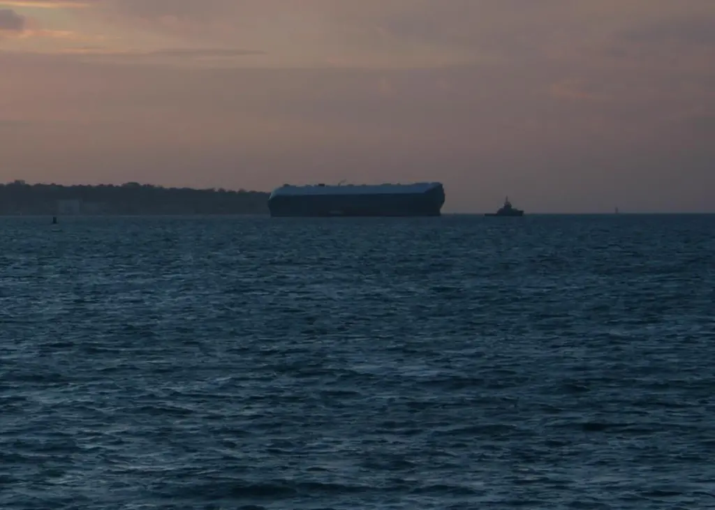 As darkness fell on Thursday 'MJ' snapped the refloated 'Hoegh Osaka' moving due east under tow with Svitzer
