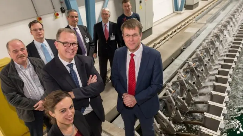 Ron van den Oetelaar (Bosch Rexroth), Bas Buchner (MARIN) and those involved at the MARIN Offshore Basin wave generator