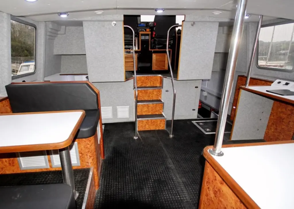 The vessel’s accommodation features a fully equipped galley in the port hull, with cooker, fridge, microwave and sink and four sleeping berths in the starboard hull