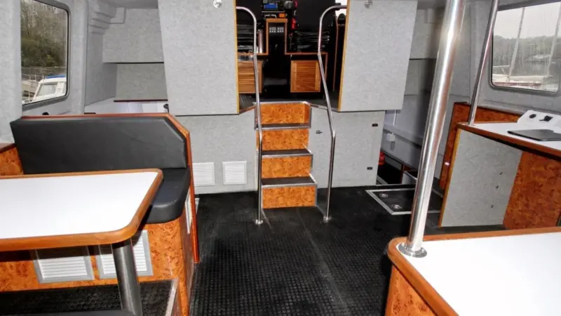 The vessel’s accommodation features a fully equipped galley in the port hull, with cooker, fridge, microwave and sink and four sleeping berths in the starboard hull