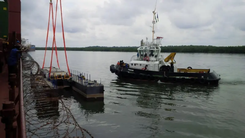 The 'Pasam' is seen here assisting with assembly of its accompanying dredger at Port Harcourt (Damen)