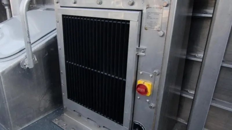 A Veotec inlet system fitted under the bulwark of a wind farm service vessel