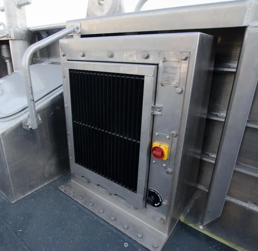 A Veotec inlet system fitted under the bulwark of a wind farm service vessel