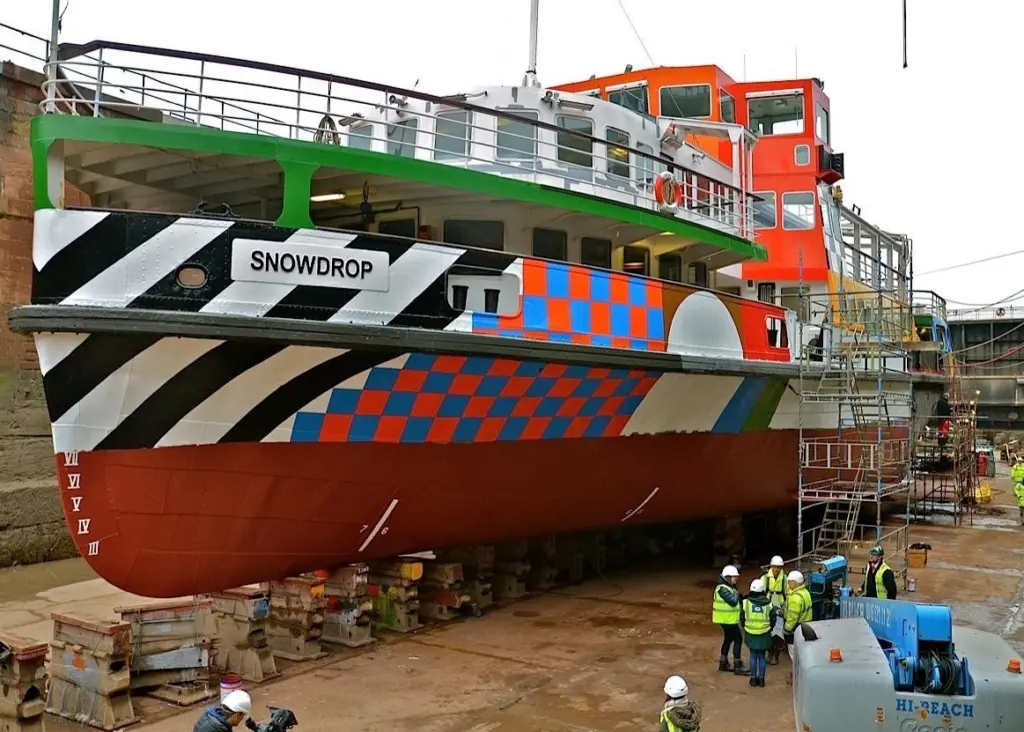 The Mersey ferry 'Snowdrop' receives her distinctive new coat of paint in Laird's dry dock