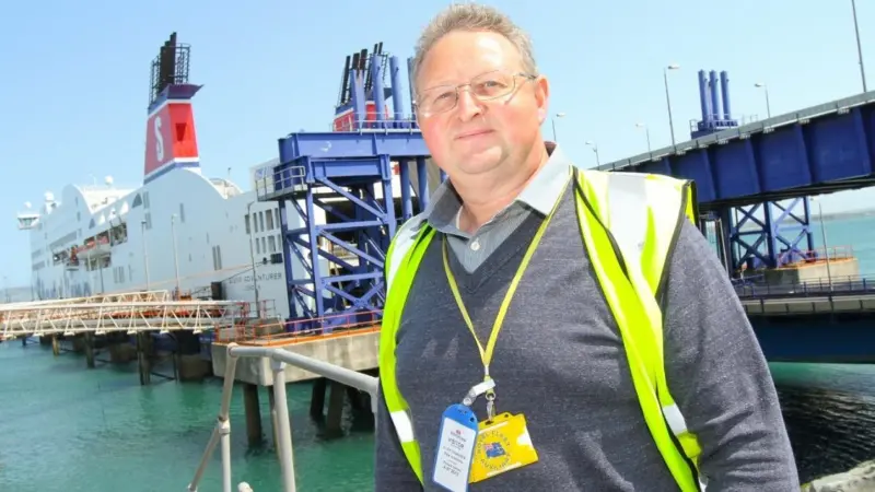 Cliff Grainger of MPE interiors in front of one of the refurbished ferries