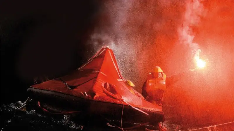 A red hand flare being used