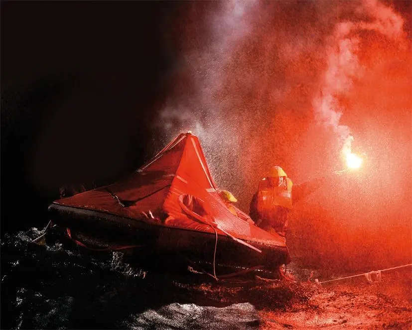 A red hand flare being used