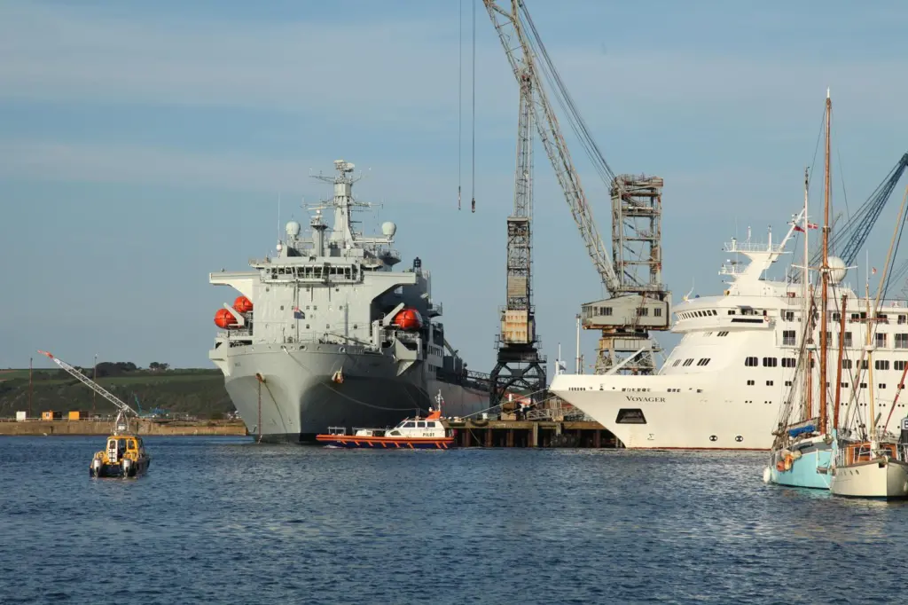 Pilot launch Arrow escorts a small cruise ship outbound past the RFA Argus. Photo (c) G Ewens