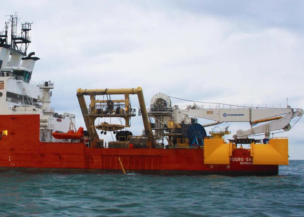 'Fugro Saltire' deploying Fugro’s Q1400 trencher and at the stern the cable-lay spread system