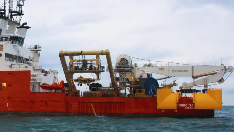 'Fugro Saltire' deploying Fugro’s Q1400 trencher and at the stern the cable-lay spread system