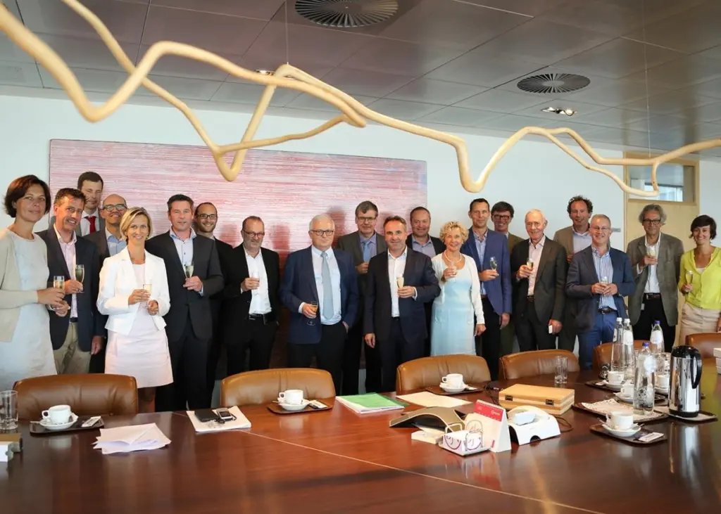 Employees of Jan de Nul NV and Algemene Ondernemingen Soetaert NV celebrate
