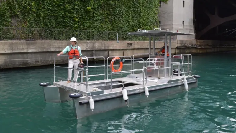 Elastec and MWRD worked together to develop two custom trash and debris collection boats