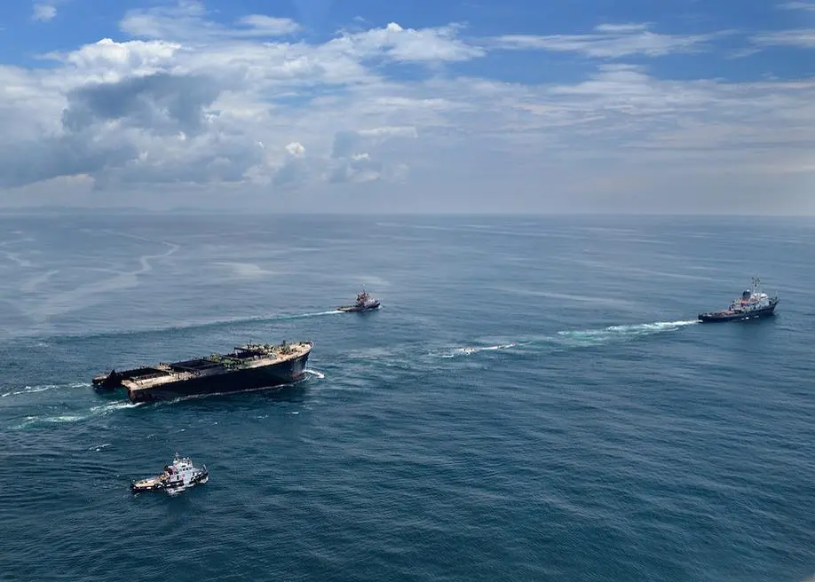 The bow section of the 'Smart' is towed away for scuttling (SAMSA)