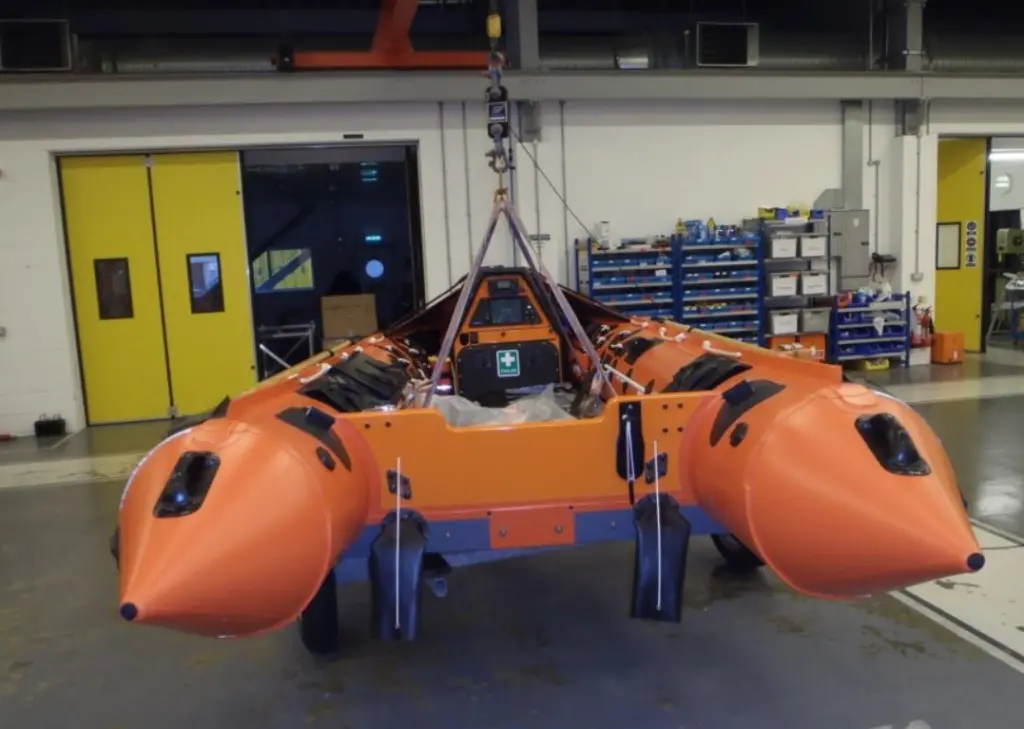 A RNLI D-Class lifeboat being lifted at the ILC