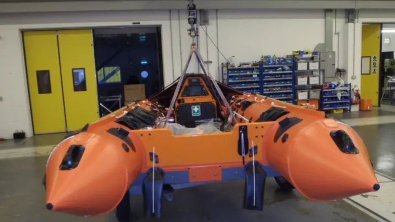 A RNLI D-Class lifeboat being lifted at the ILC