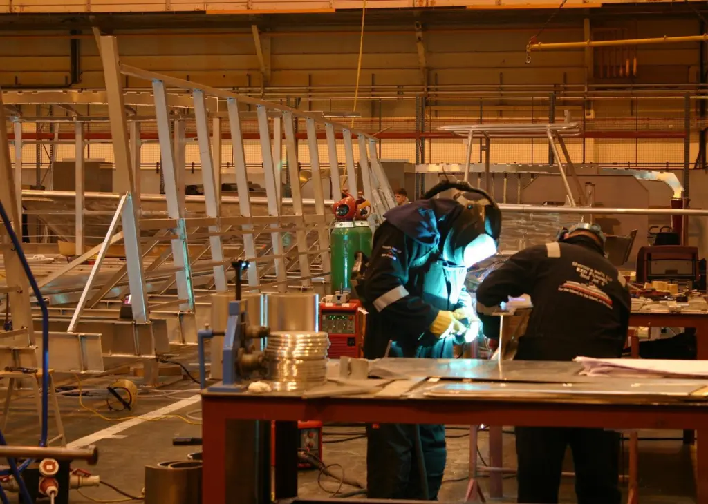 Workers beginning to weld up deck beams for 'RedJet 6'