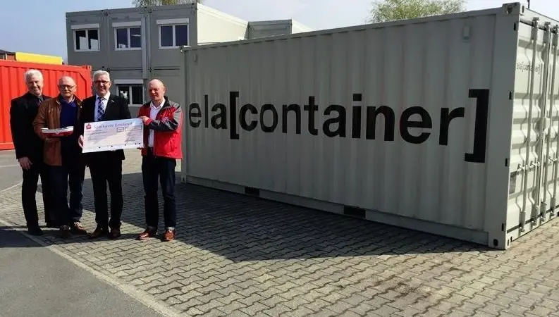 ELA handing over the cheque of 1,084.90 Euros