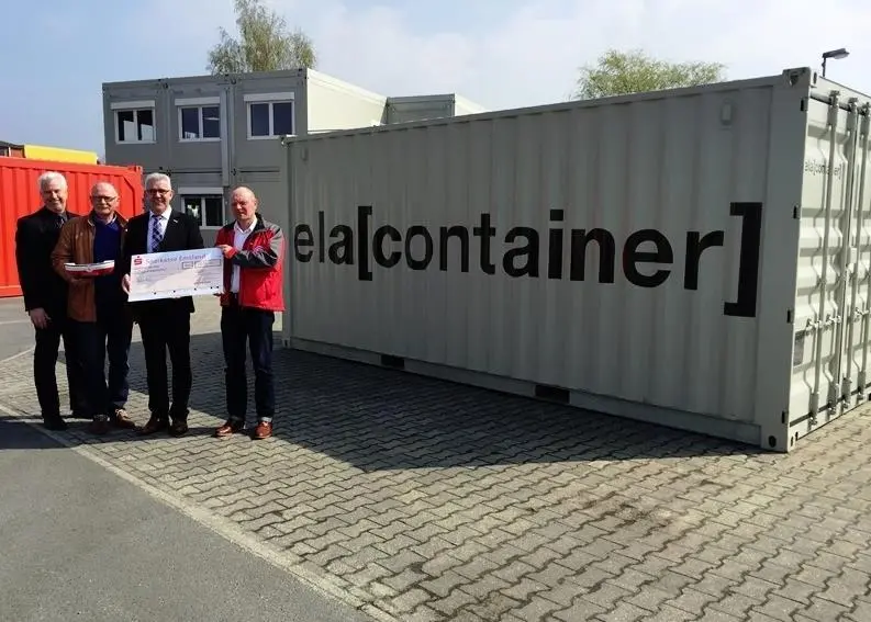 ELA handing over the cheque of 1,084.90 Euros