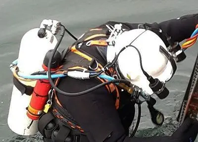A specialist clearance diver equipped with a Sonardyne WSM 6