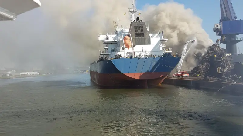 The tugs shifted a bulk carrier moored at the facility to a safe berthing place away from the blaze