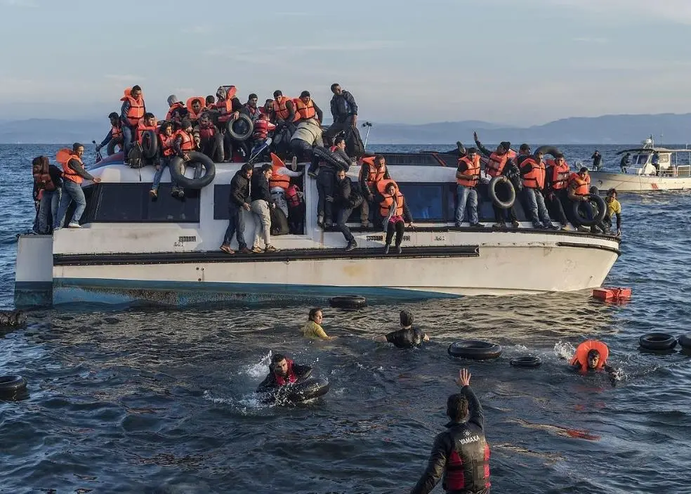 Migrants at Lesbos (Photo: Ggia/ Wikimedia Commons)