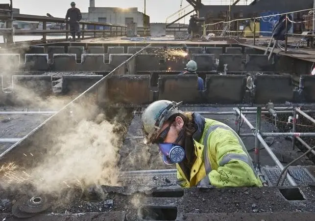 170 people worked night and day to cut out and remove the old floor