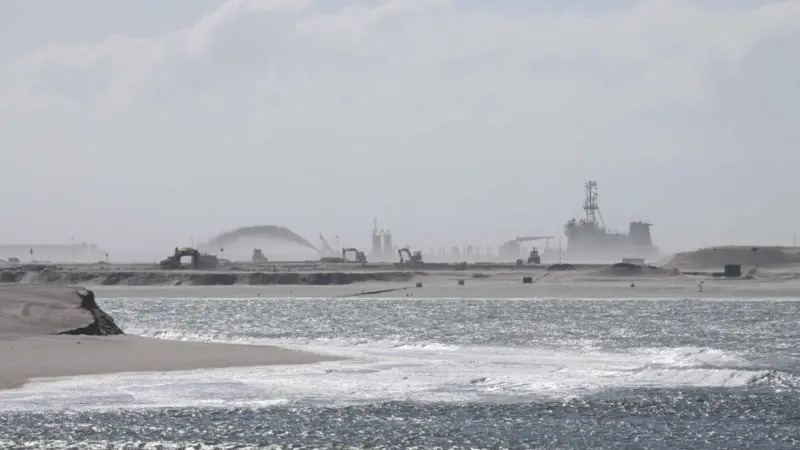 Over time dredgers and plant have won new land from the sea (Peter Barker)