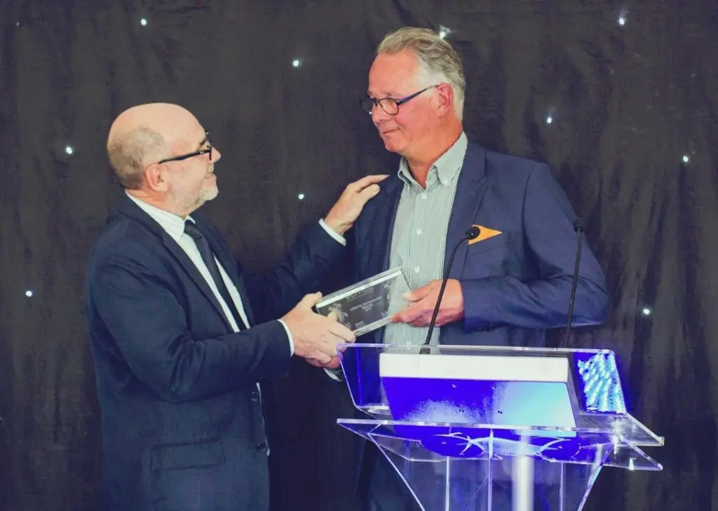 Andrew Webster of Mercator Media (left) presents the Lifetime Achievement Award to Casper Vermeulen of Damen Shipyards
