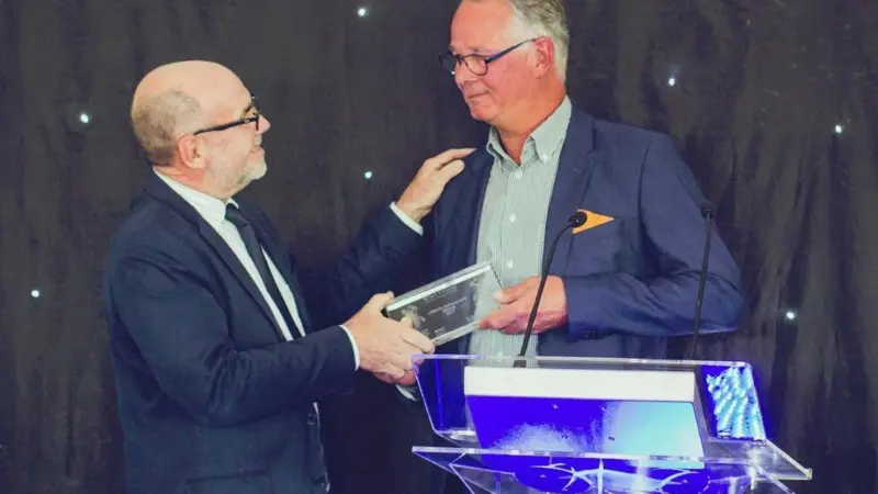 Andrew Webster of Mercator Media (left) presents the Lifetime Achievement Award to Casper Vermeulen of Damen Shipyards