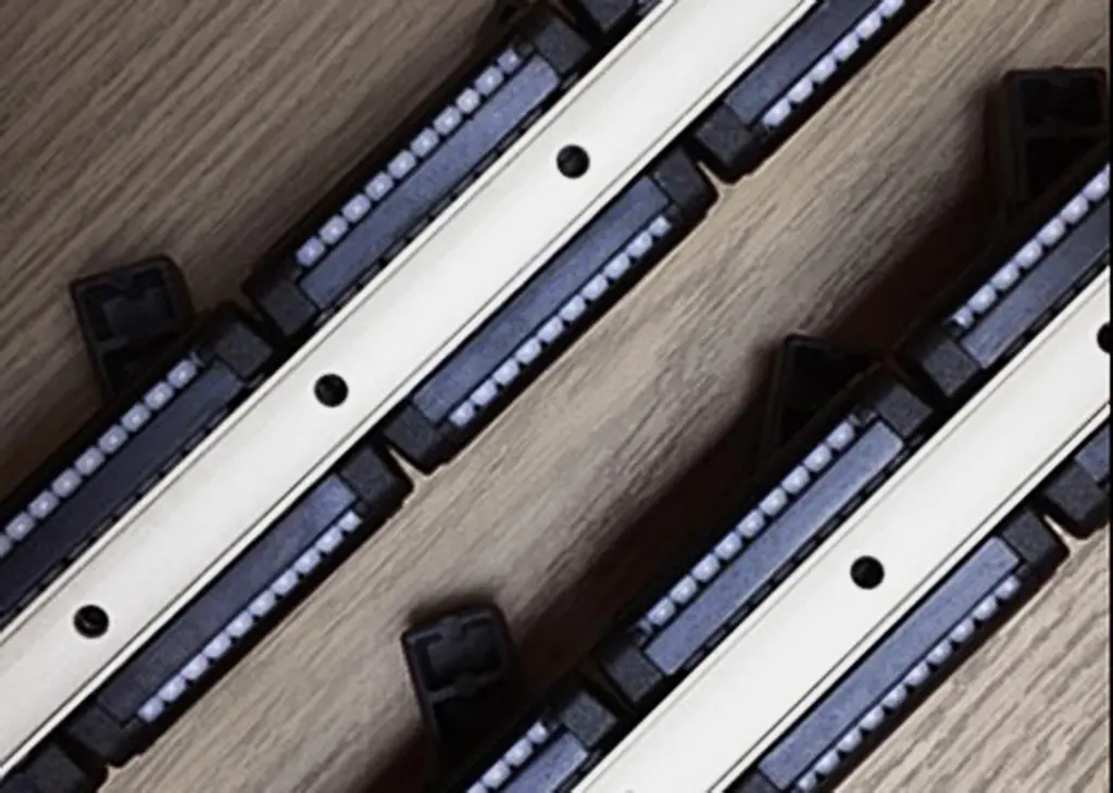 Photo of (unfitted) tracks showing the bearings that help the loads glide