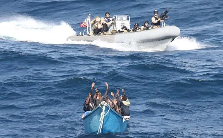 Suspected Somali pirates surrender to a US Navy patrol (Photo: US Navy/ Wikepedia Commons)