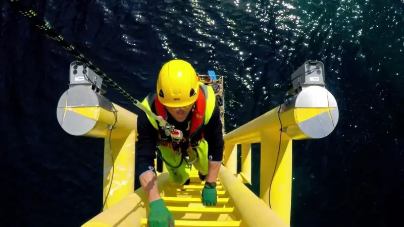 A technician accesses an offshore turbine during the O&M phase