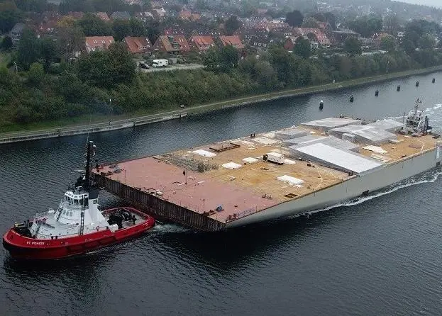 The sections are pre-fabricated modules for the new cruise ship Aidanova and need to be transferred from Neptun Werft in Rostock to Meyer Werft’s shipyard in Papenburg