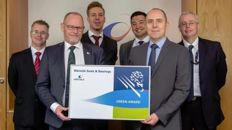 Wärtsilä employees celebrate the partnership