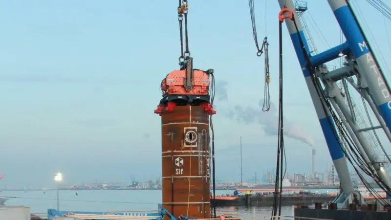 Driving the pile free hanging from crane