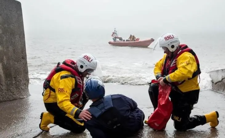 Crew members giving casualty care to a mock casualty during an exercise featuring a drone (Photo: RNLI/ Nathan Williams)
