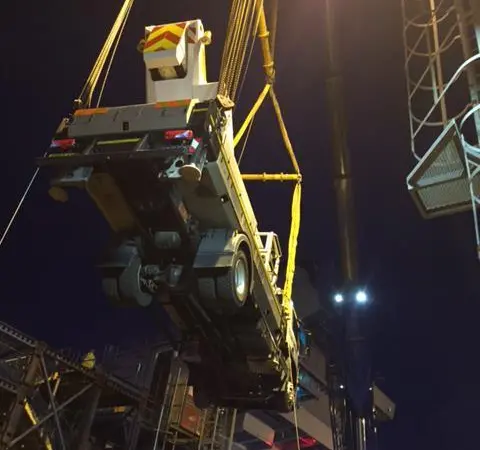 Outreach's specialist access vehicle being craned about the  Queen Elizabeth aircraft carrier