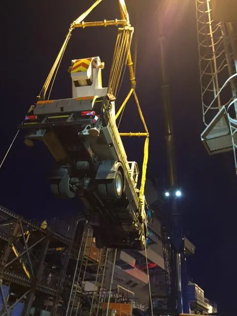 Outreach's specialist access vehicle being craned about the  Queen Elizabeth aircraft carrier