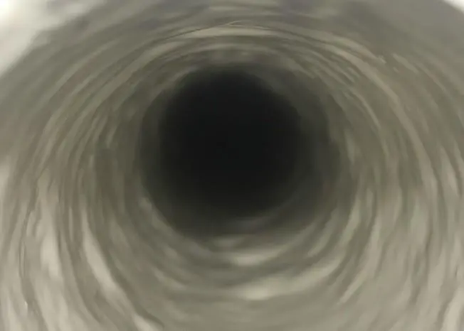 The repair process involves heating and cleaning the pipe to remove all debris and scale, then the barrier coating is applied using airflow or a rotating head