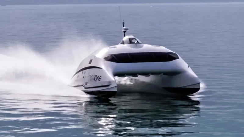 It is the lift generated by the wing structure that lifts the catamaran hulls in the water