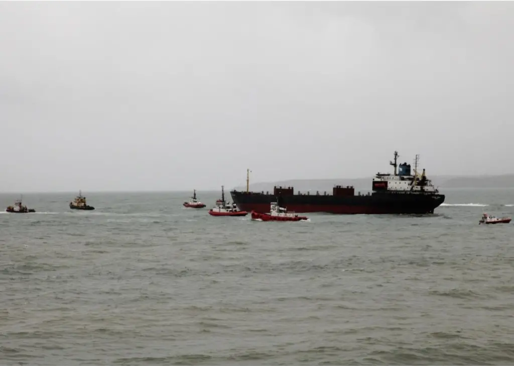 The freed vessel towed back to the anchorage (Photo: Graeme Ewens)
