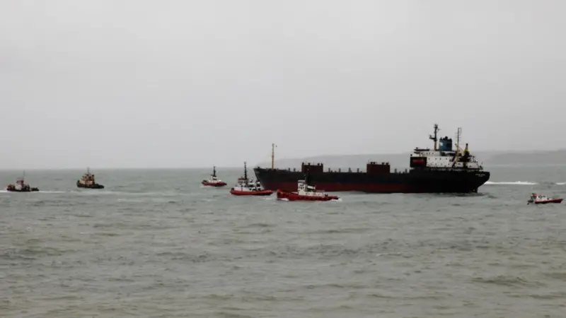 The freed vessel towed back to the anchorage (Photo: Graeme Ewens)