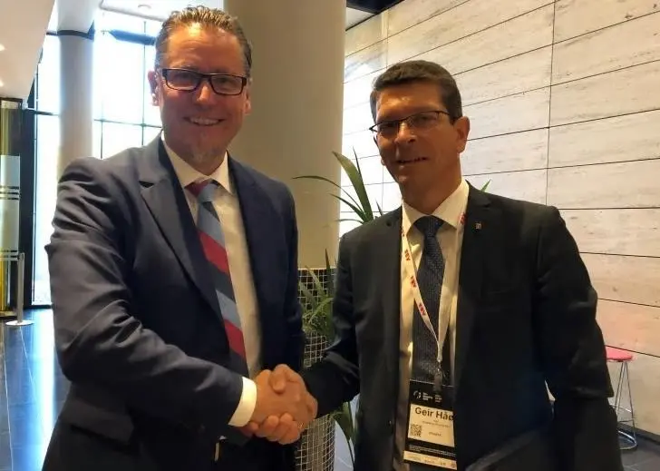 Remi Eriksen, Group President and CEO of DNV GL, with Kongsberg President and CEO Geir Håøy