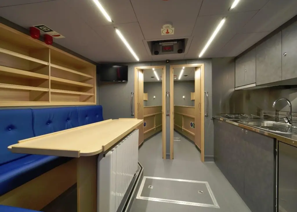 The vessel has a galley mess area with seating for four